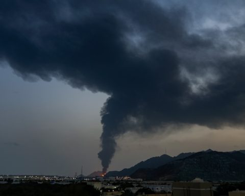 Large fire and plume of smoke is visible after, according to the authorities, debris of an Iranian intercepted drone hit the Fujairah oil facility, in Fujairah, United Arab Emirates, Tuesday, March 3, 2026. (AP Photo/Altaf Qadri)