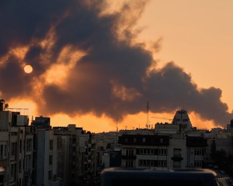 A plume of smoke rises following a U.S.-Israeli military strike in Tehran, Iran, Tuesday, March 3, 2026. (AP Photo/Vahid Salemi)