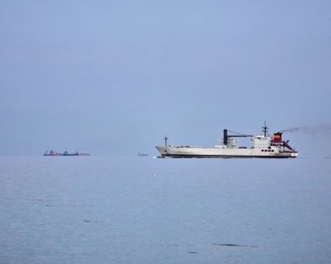 Ships wait offshore in the Strait of Hormuz off Khor Fakkan, United Arab Emirates, Wednesday, March 11, 2026. (AP Photo/Altaf Qadri)