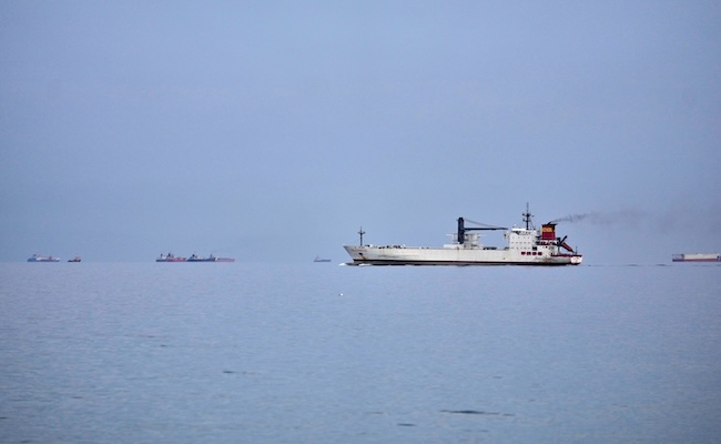 Ships wait offshore in the Strait of Hormuz off Khor Fakkan, United Arab Emirates, Wednesday, March 11, 2026. (AP Photo/Altaf Qadri)