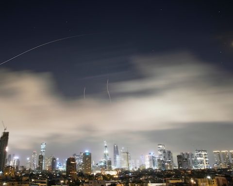 Israeli air defense system fires to intercept missiles during an Iranian attack over Tel Aviv, Israel, early Sunday, March 15, 2026. (AP Photo/Ohad Zwigenberg)