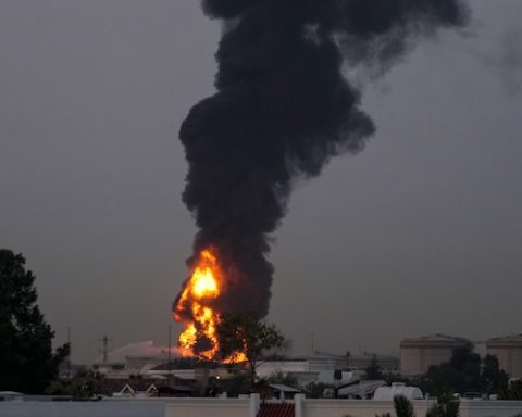 Fire and plumes of smoke rises after a drone struck a fuel tank forcing the temporary suspension of flights. near Dubai International Airport, in United Arab Emirates, early Monday, March 16, 2026. (AP Photo)