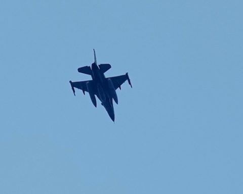 An Israeli warplane flies over the city of Tyre, south Lebanon, Wednesday, March 25, 2026. (AP Photo/Hussein Malla)
