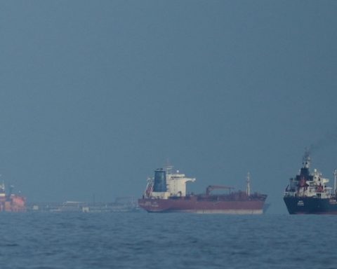 Oil tankers and cargo ships line up in the Strait of Hormuz as seen from Khor Fakkan, United Arab Emirates, Wednesday, March 11, 2026. (AP Photo/Altaf Qadri)