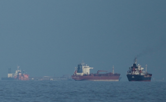 Oil tankers and cargo ships line up in the Strait of Hormuz as seen from Khor Fakkan, United Arab Emirates, Wednesday, March 11, 2026. (AP Photo/Altaf Qadri)