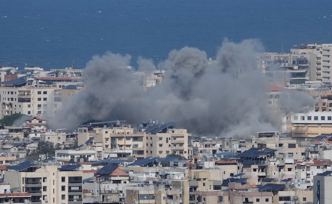 Smoke rises following an Israeli airstrike in Dahiyeh, Beirut's southern suburbs, Lebanon, Monday, March 30, 2026. (AP Photo/Bilal Hussein)