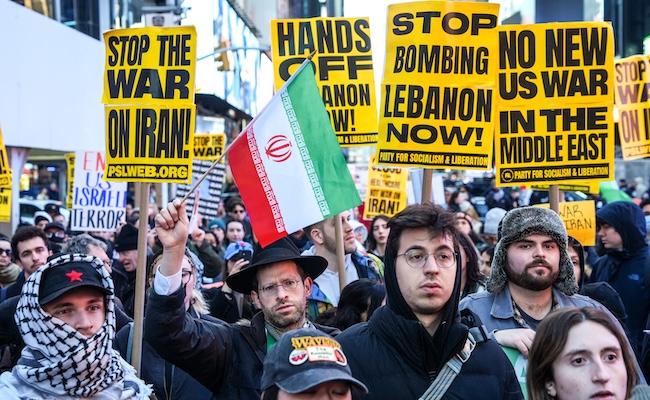 People march while taking part in a protest against the U.S.-Israeli war with Iran, and against conflict in Lebanon, Wednesday, April 8, 2026, in New York. (AP Photo/Ryan Murphy)