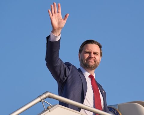 Vice President JD Vance waves while boarding Air Force Two as he leaves Islamabad, Sunday, April 12, 2026, after attending talks on Iran. (AP Photo/Jacquelyn Martin, Pool)