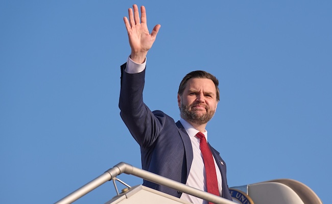 Vice President JD Vance waves while boarding Air Force Two as he leaves Islamabad, Sunday, April 12, 2026, after attending talks on Iran. (AP Photo/Jacquelyn Martin, Pool)