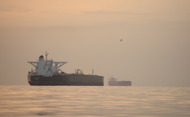 Tankers anchored in the Strait of Hormuz off the coast of Qeshm Island, Iran, Saturday, April 18, 2026. (AP Photo/Asghar Besharati)