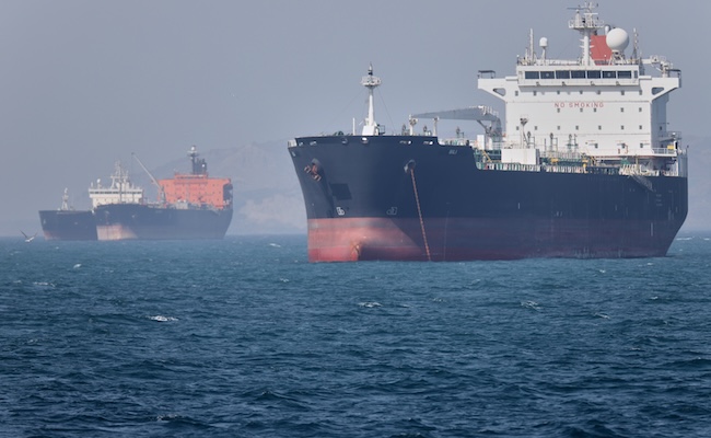 Oil tankers sit at anchor offshore in the Strait of Hormuz off Bandar Abbas, Iran, Saturday, May 2, 2026. (Amirhosein Khorgooi/ISNA via AP)