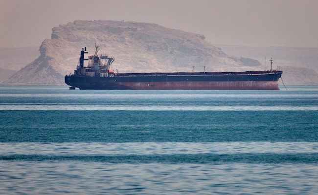 A bulk cargo ship sits at anchor in the Strait of Hormuz off Bandar Abbas, Iran, Saturday, May 2, 2026.(Amirhosein Khorgooi/ISNA via AP)
