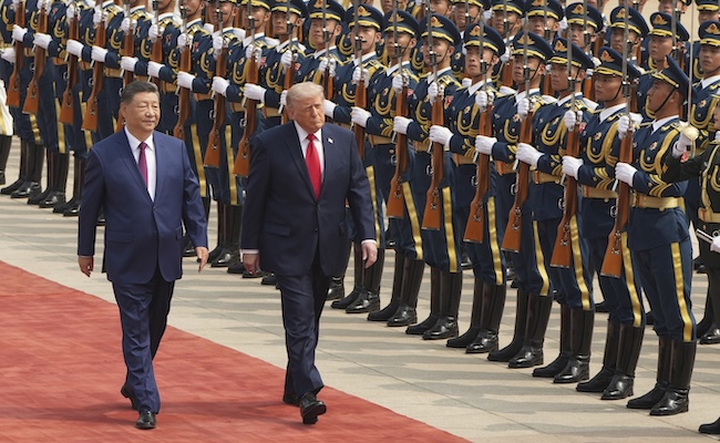 President Donald Trump participates in a welcome ceremony with China's President Xi Jinping at the Great Hall of the People, Thursday, May 14, 2026, in Beijing. (AP Photo/Mark Schiefelbein)