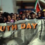 People participate in a march to commemorate Youth Day in Soweto on June 16 2013 in Johannesburg. (Photo by Jeff J Mitchell/Getty Images)