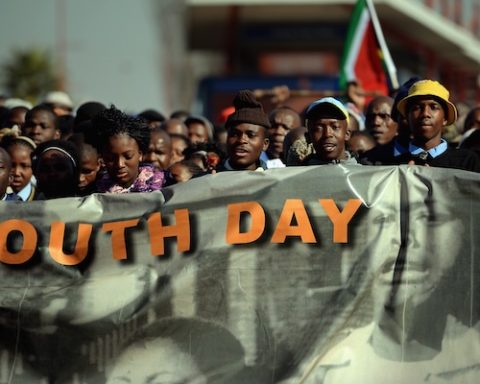 People participate in a march to commemorate Youth Day in Soweto on June 16 2013 in Johannesburg. (Photo by Jeff J Mitchell/Getty Images)