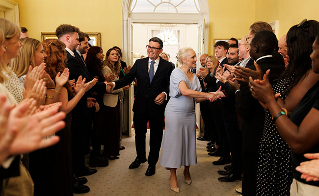 Prime Minister Andy Burnham and his wife Marie-France van Heel are clapped in as they arrive at 10 Downing Street on July 20. Picture: Simon Dawson/No. 10 Downing Street. Creative Commons.